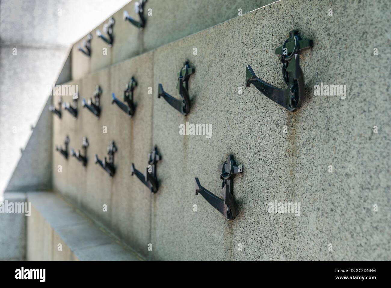 The National Submariners' War Memorial attached to the Embankment, London adorned with minature weathered cast iron anchors 2 Stock Photo