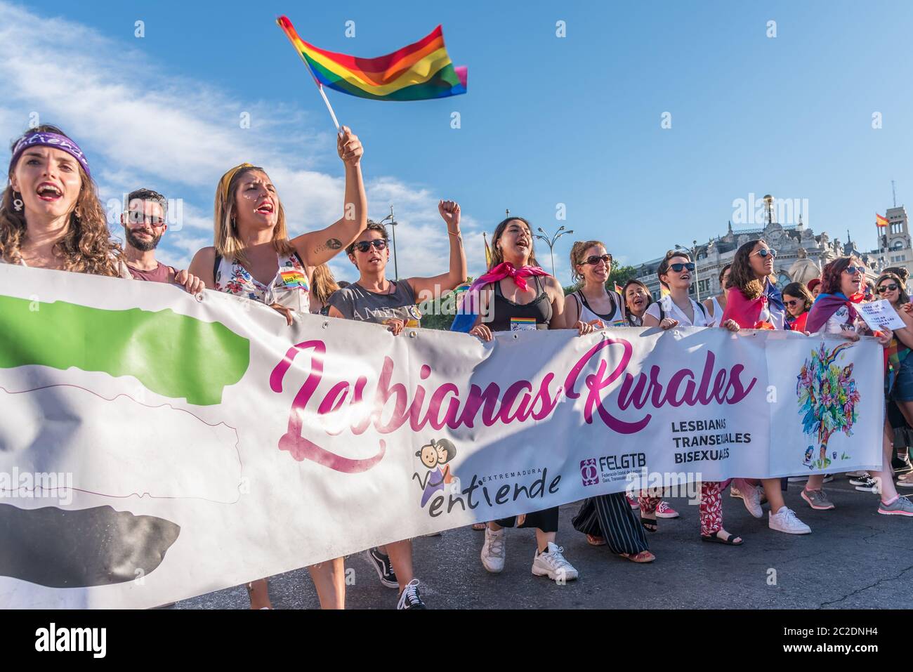 Madrid, Spain - July 06, 2019: in Madrid, Gay pride day celebrations. A group of lesbians standing in front of a crowd Stock Photo
