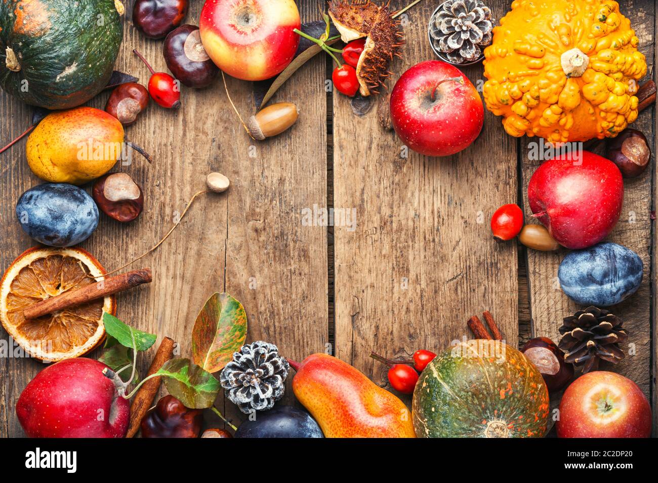 Fruits and pumpkins,nut in autumn still life on wooden table.Fall still ...