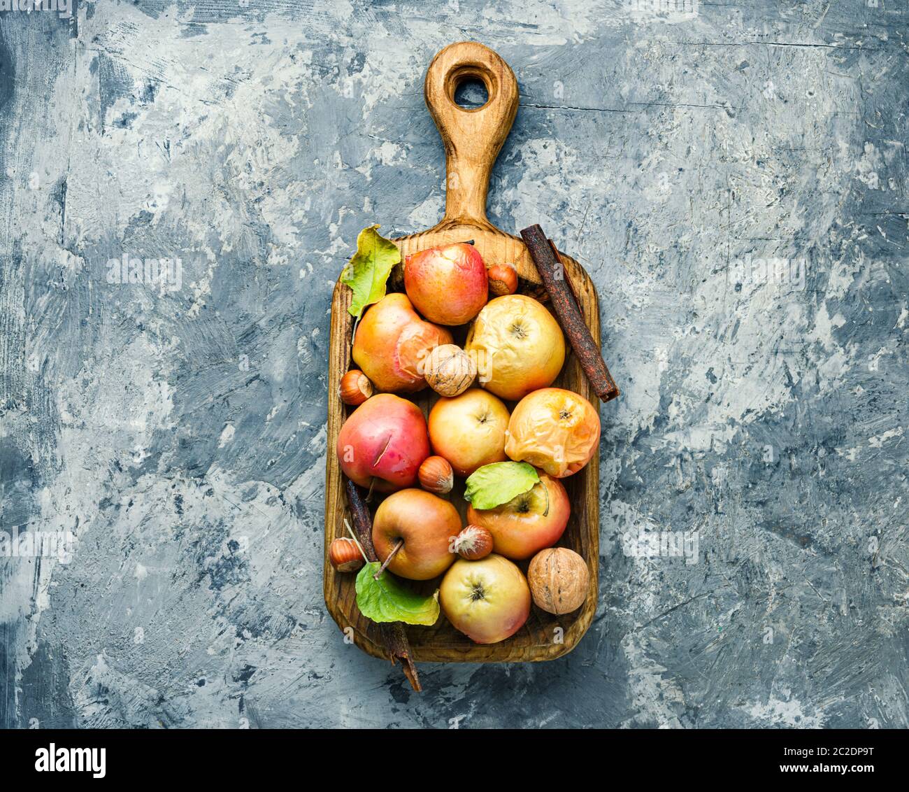 Baked apples with cinnamon and nuts.Fruit dessert baked red apples