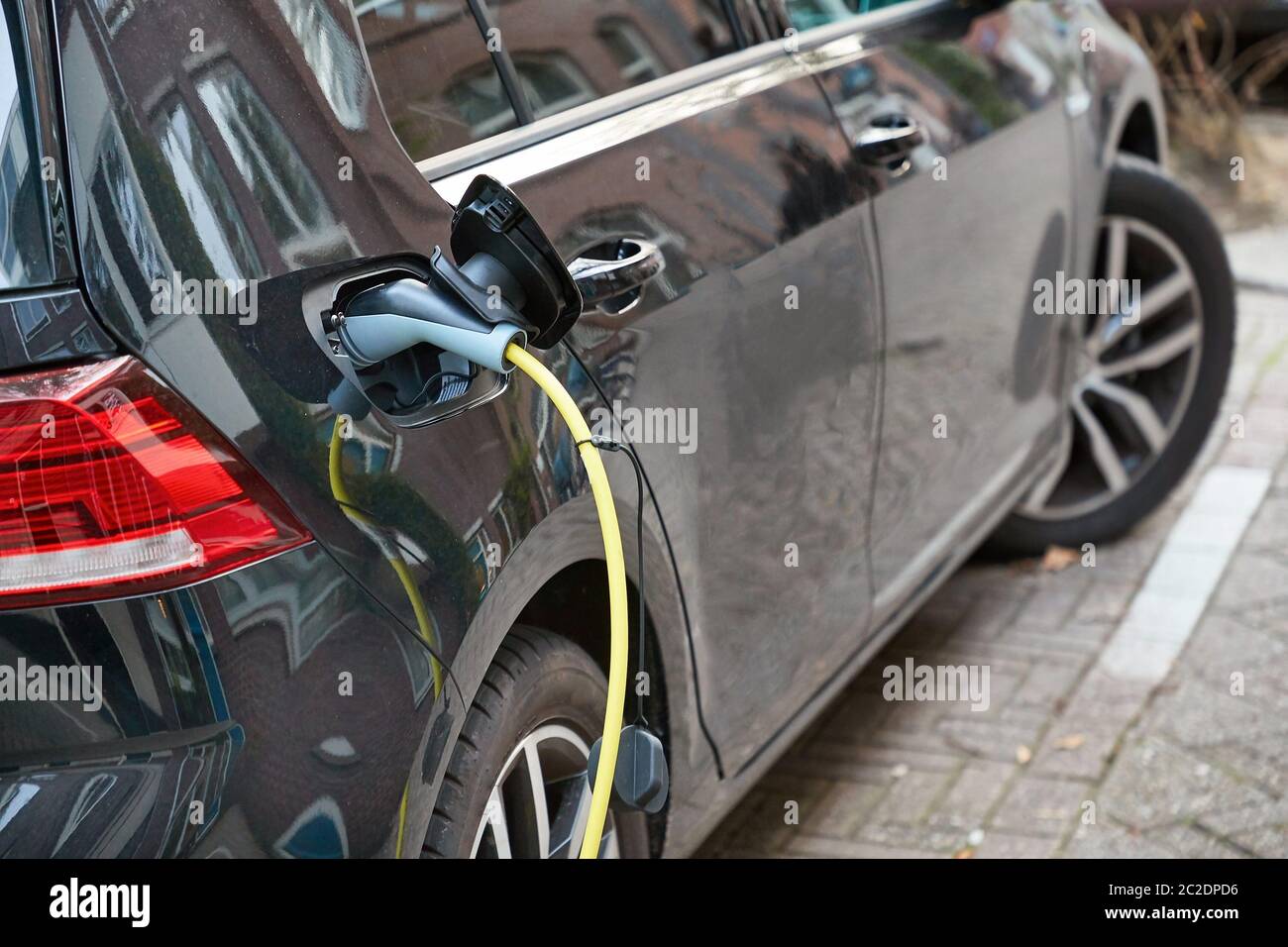 Electric car at a charging station Stock Photo