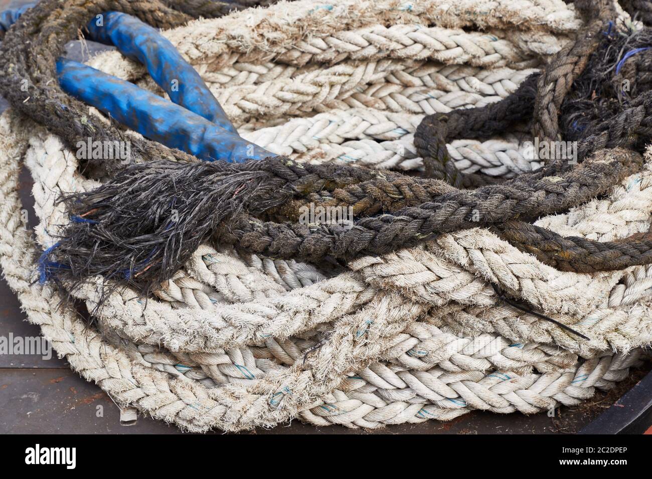Old rope piled up on the floor Stock Photo - Alamy