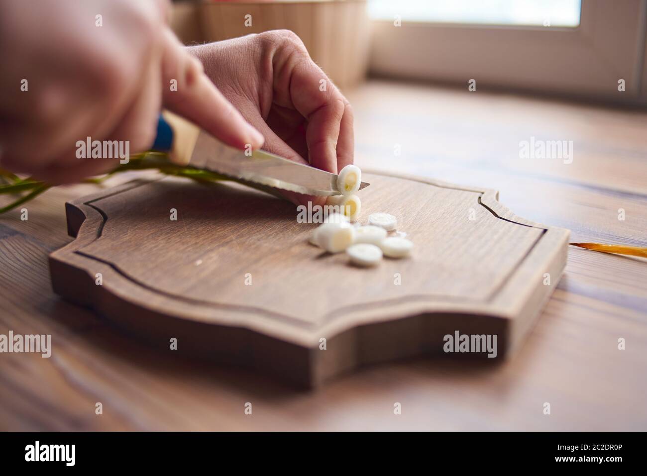 Man cutting onions hi-res stock photography and images - Alamy