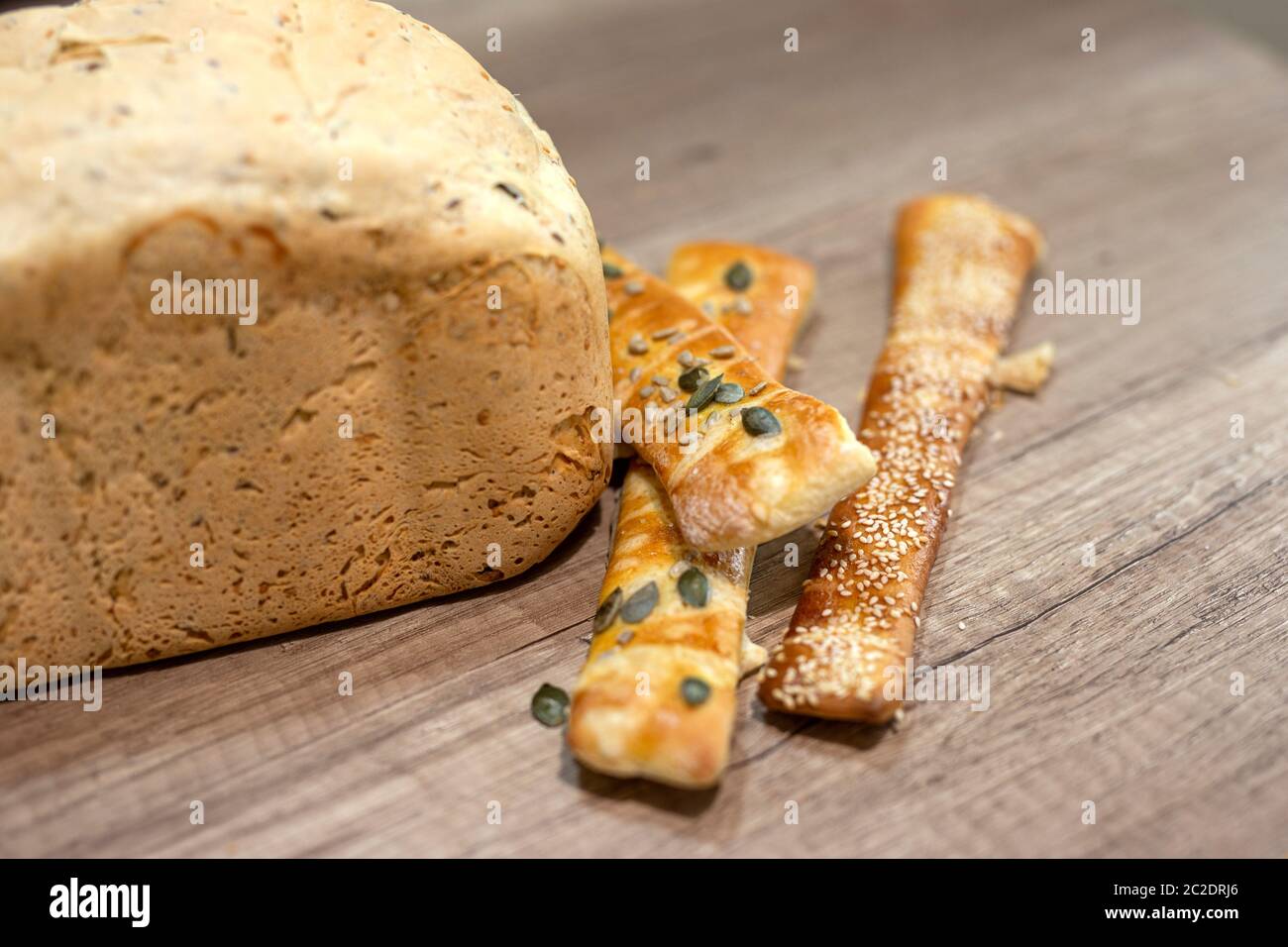 Molded home made bread and roll on table Stock Photo