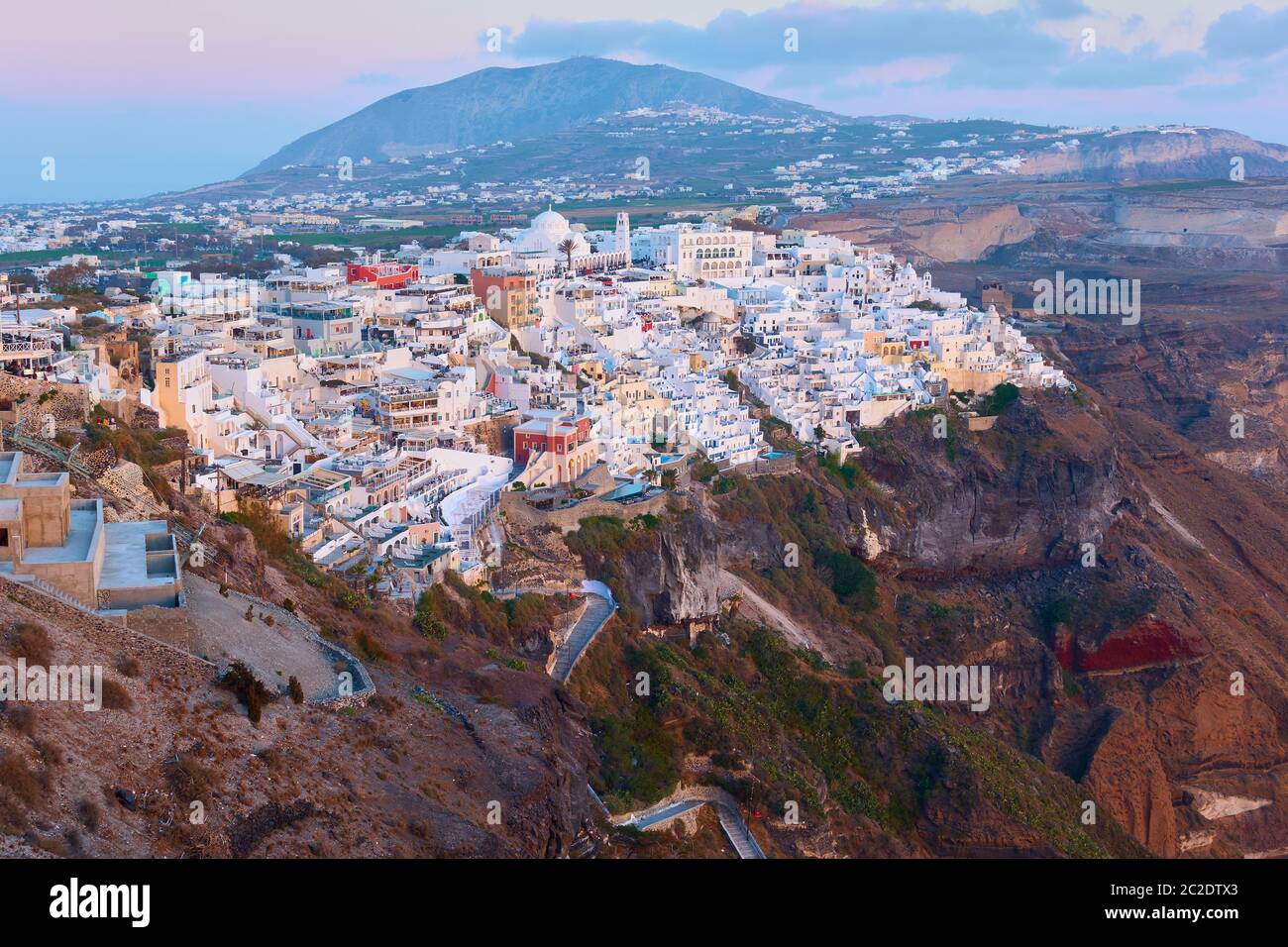 View of Thira town in Santorini island in Greece at twilight. Greek landscape Stock Photo
