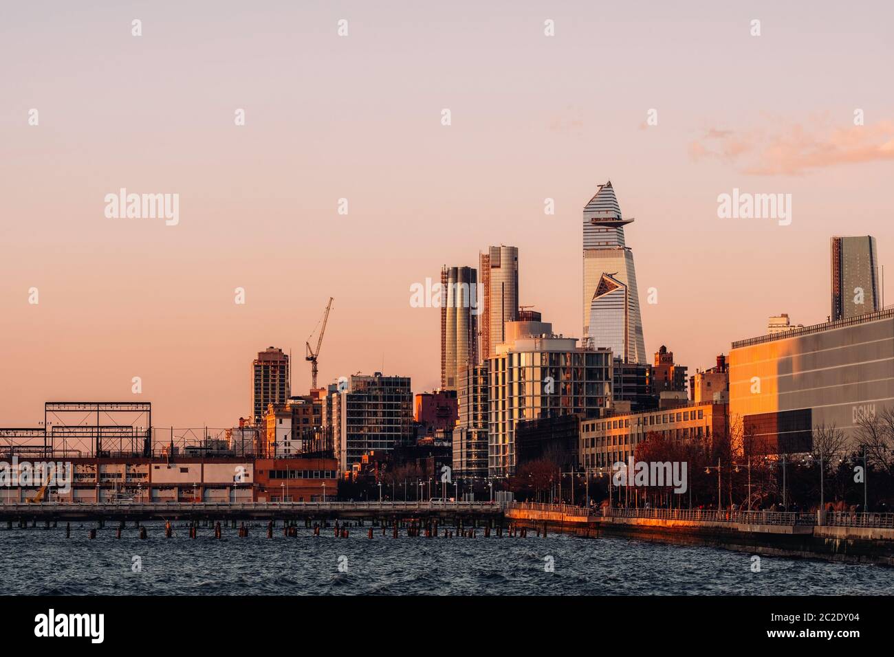 Group of buildings and skyscrapers of Hudson Yards view from pier 26 at sunset in TriBeca District Lower Manhattan New York City Stock Photo