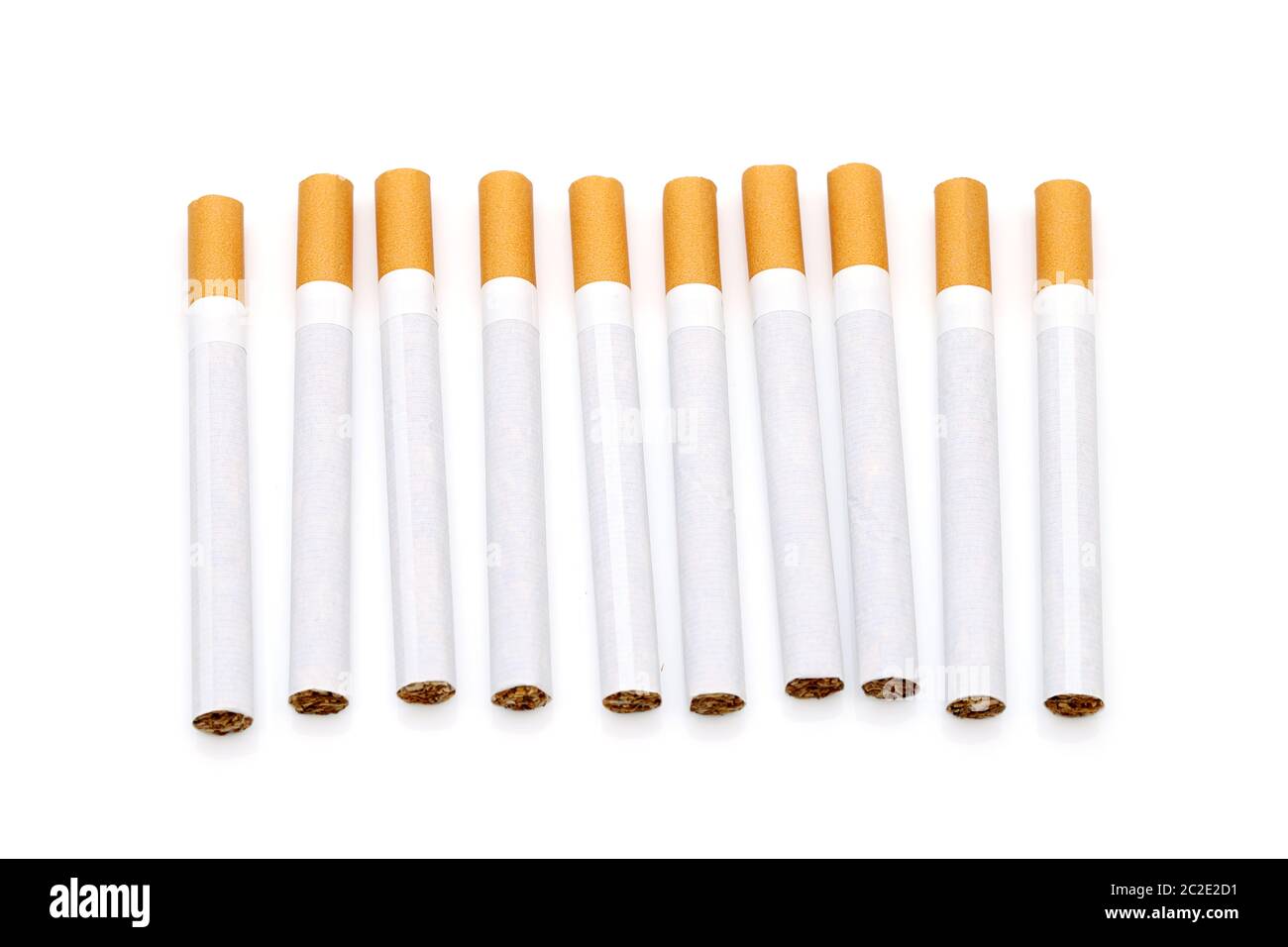 Row of cigarettes on a white background Stock Photo