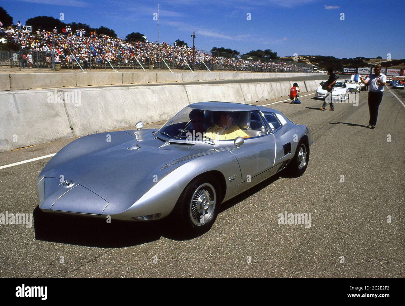Larry Shinoda in a 1962 Corvair Monza Gt at the 1987 Monterey Historic Automobile Races Laguna Seca California. Stock Photo