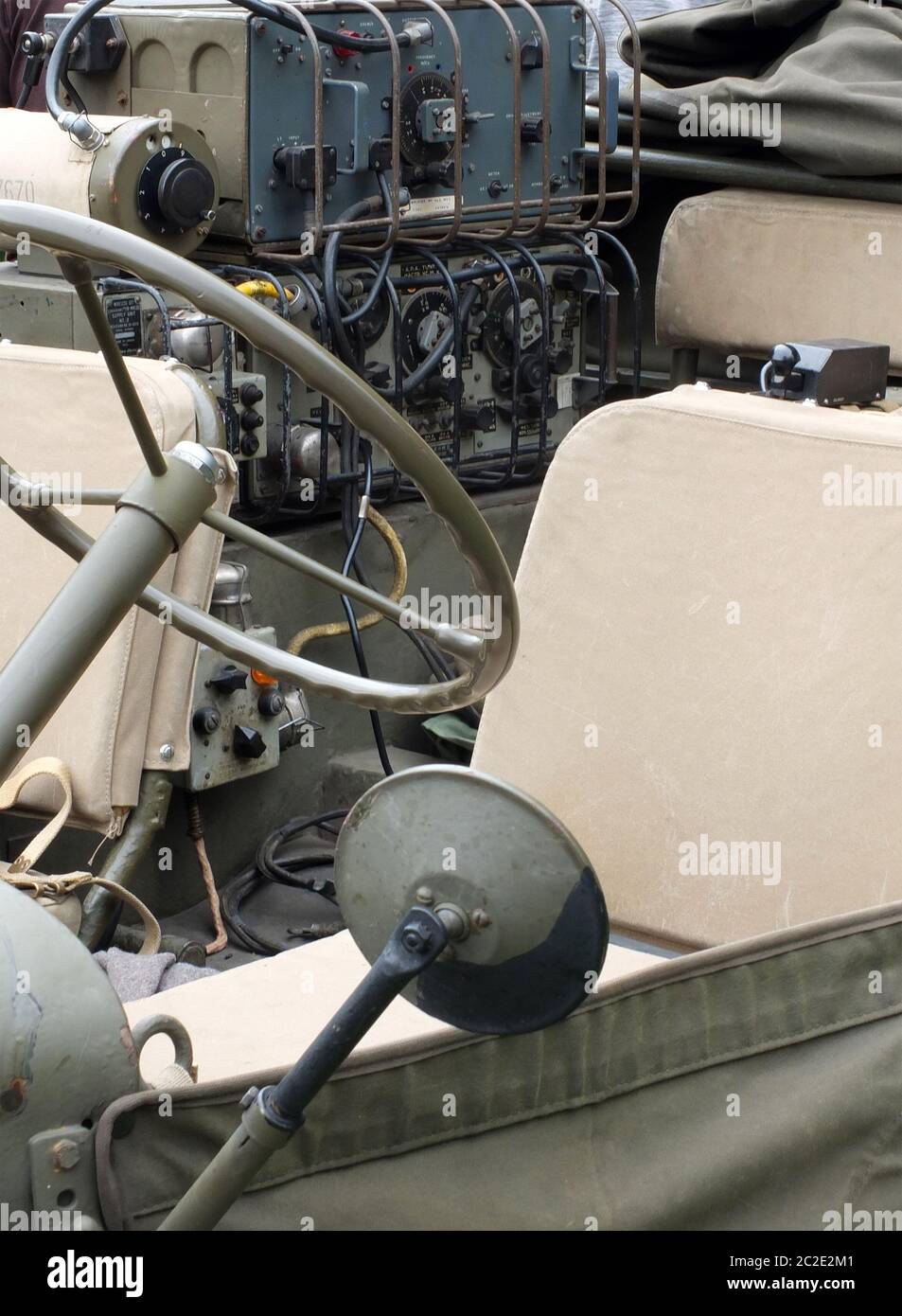 close up of the driving wheel and radio equipment in a vintage world ...
