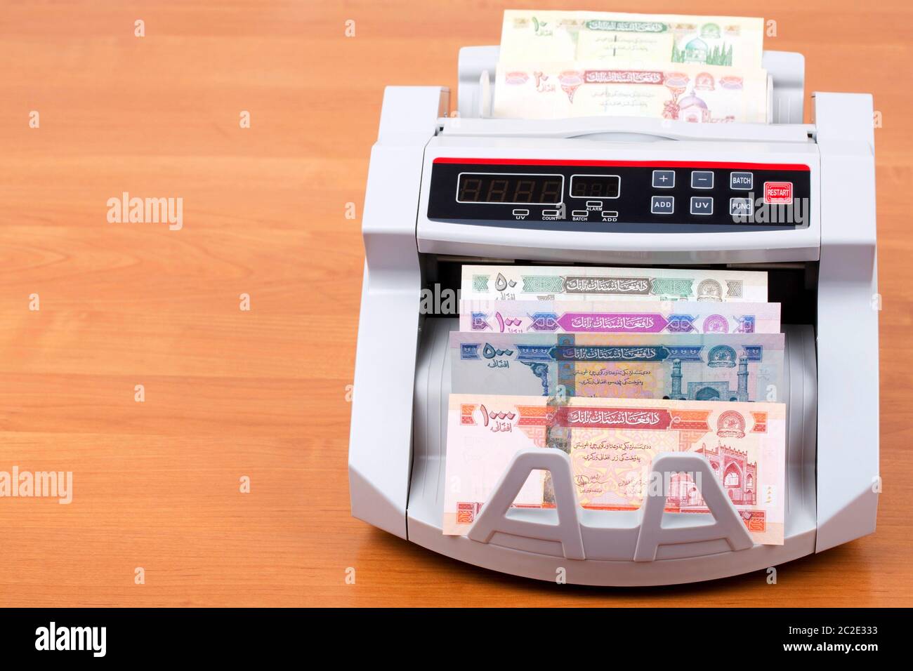 Afghan afghani in a counting machine Stock Photo