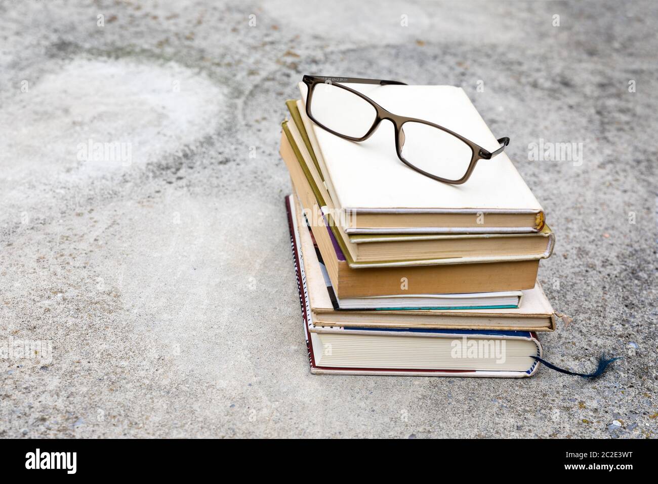 books and reading glasses Stock Photo