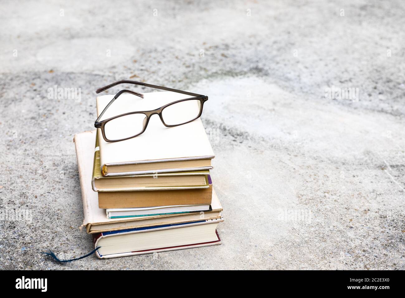 books and reading glasses Stock Photo