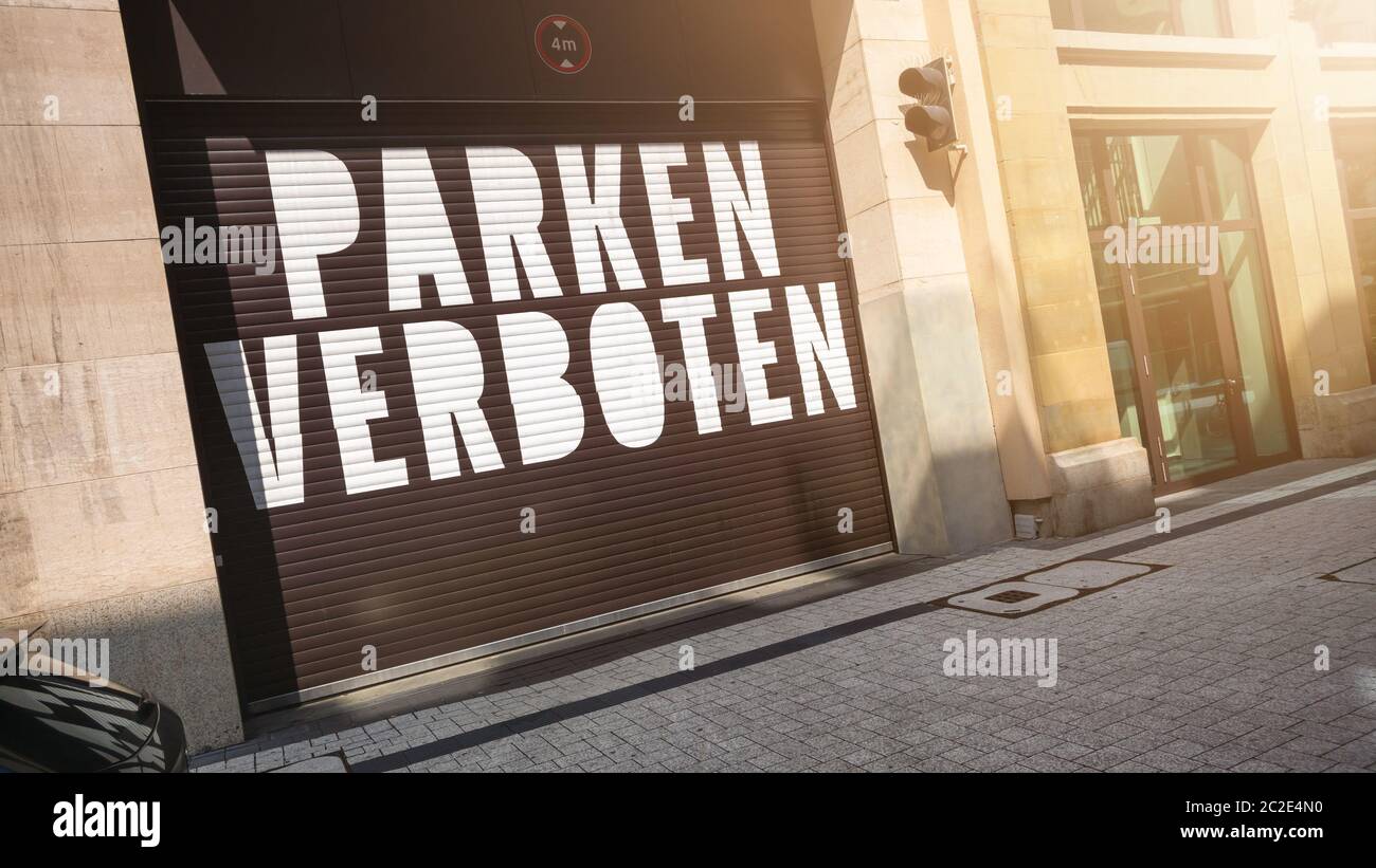 the text parking forbidden in german language on a garage door Stock