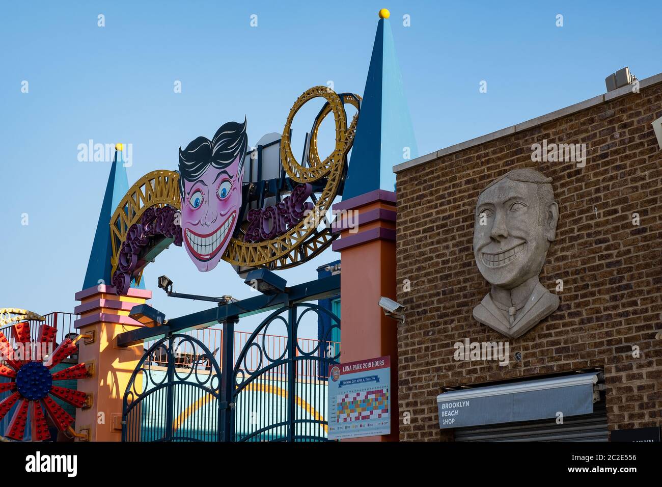 Coney island clown face sign on the wall and Luna Park in Coney Island Stock Photo