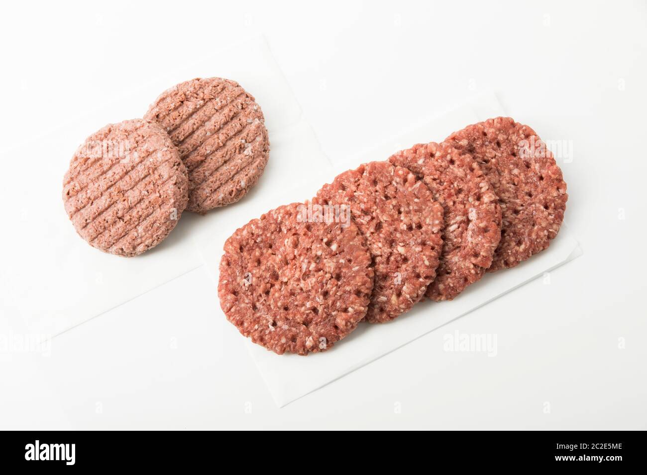 Vegan Burger Patties vs. beef patties Stock Photo Alamy