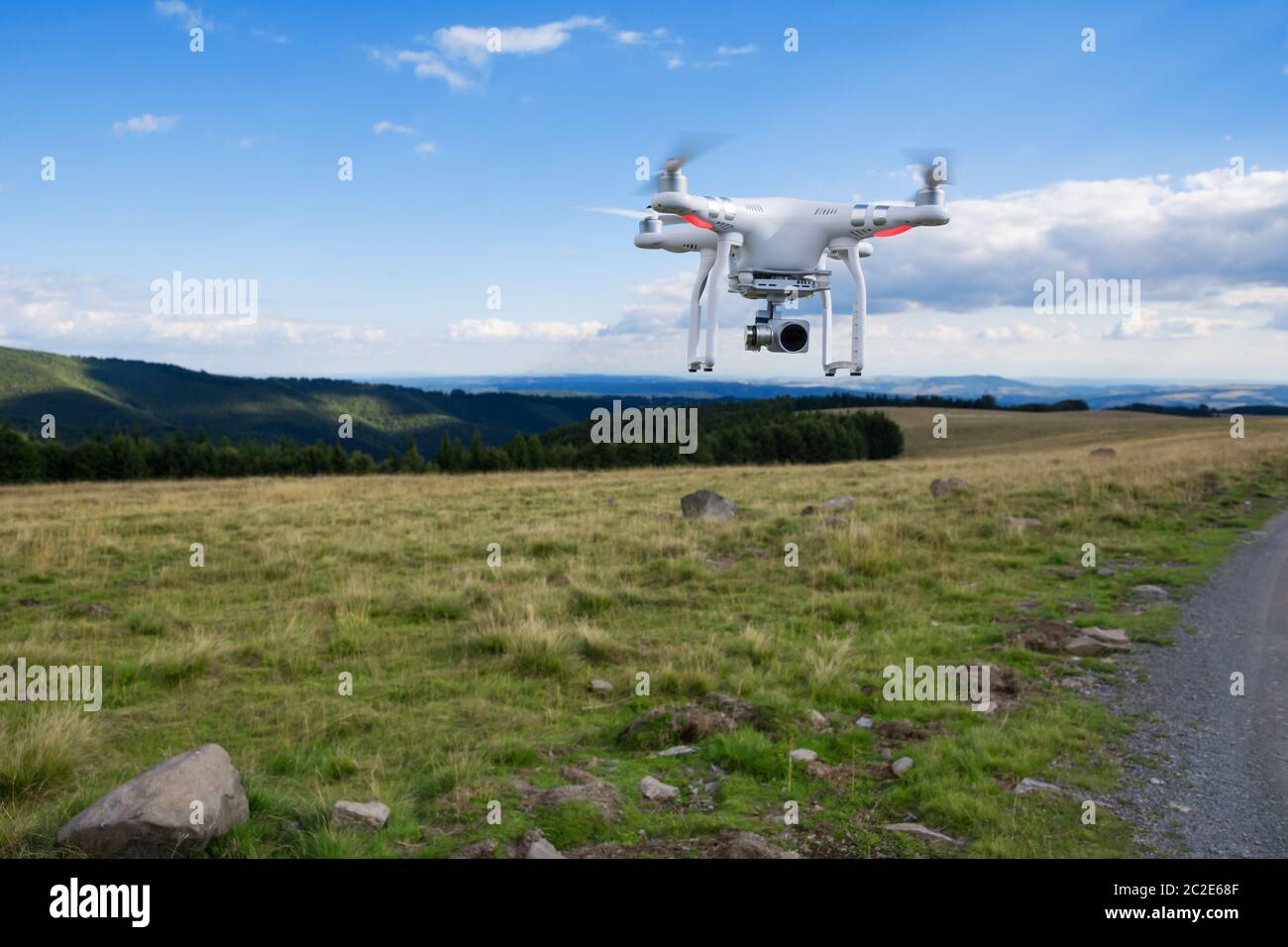 Drone flying high in blue hi-res stock photography and images - Alamy