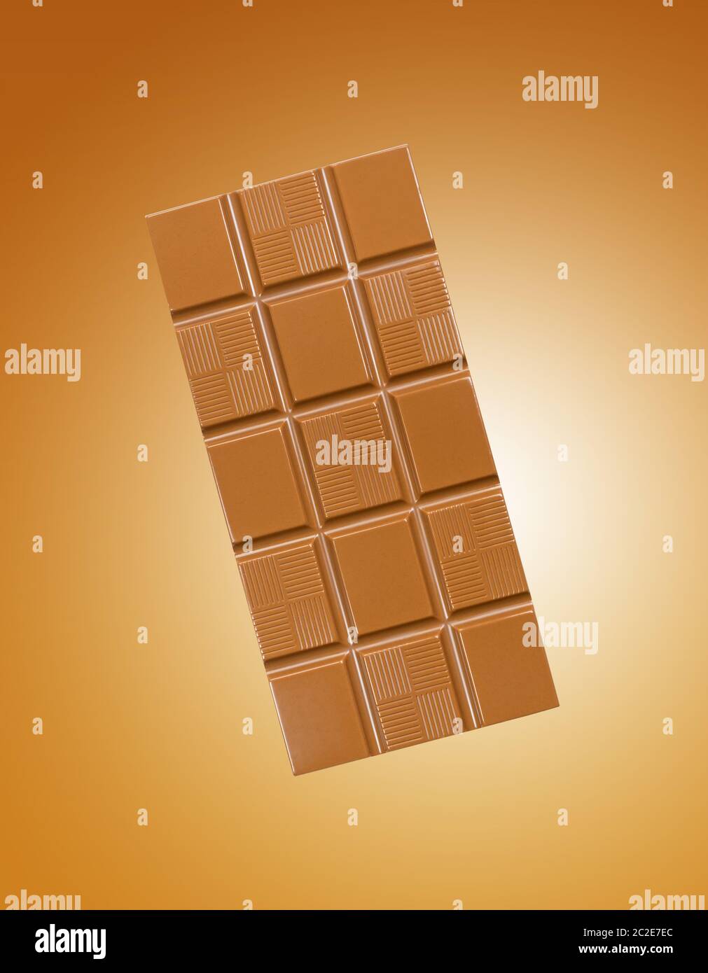 Chocolate bar on gold gradient background Stock Photo Alamy