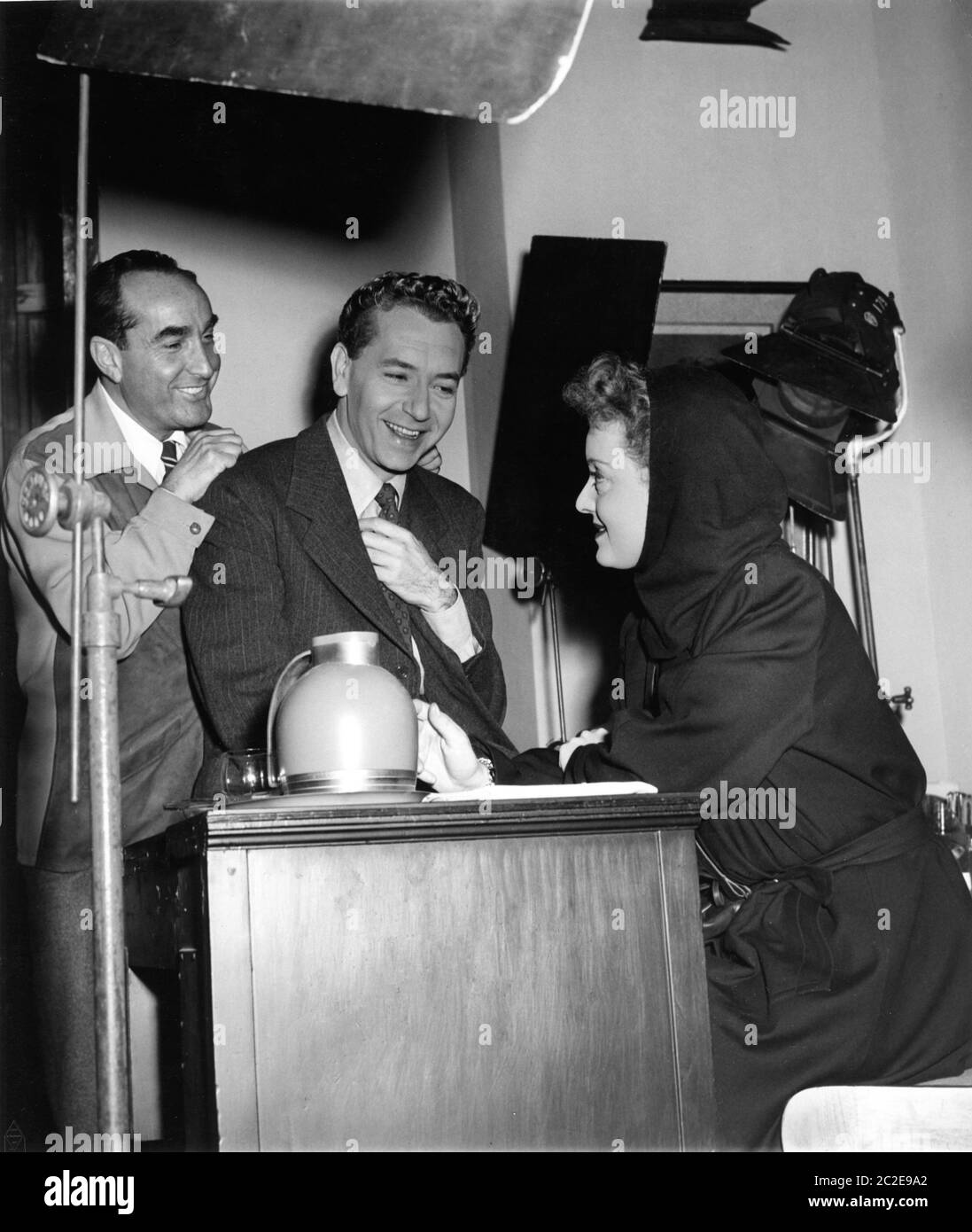 Director IRVING RAPPER PAUL HENRIED and BETTE DAVIS on set candid during filming of DECEPTION 1946 music Erich Wolfgang Korngold Warner Bros. Stock Photo