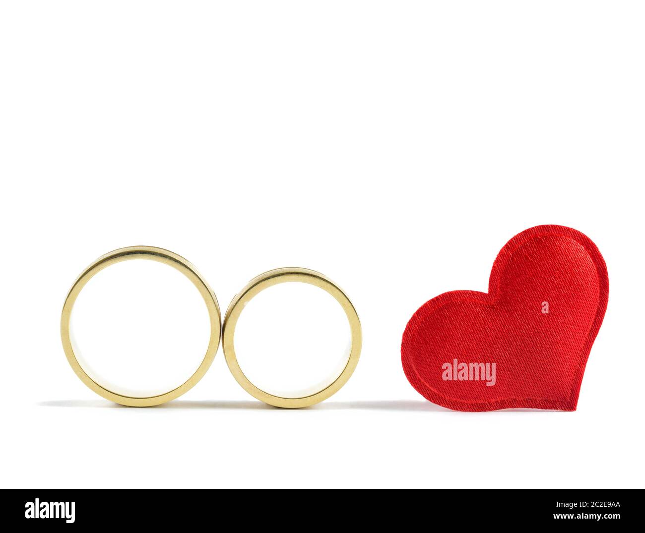 Wedding rings and read heart on white background. Concept for love Stock  Photo - Alamy