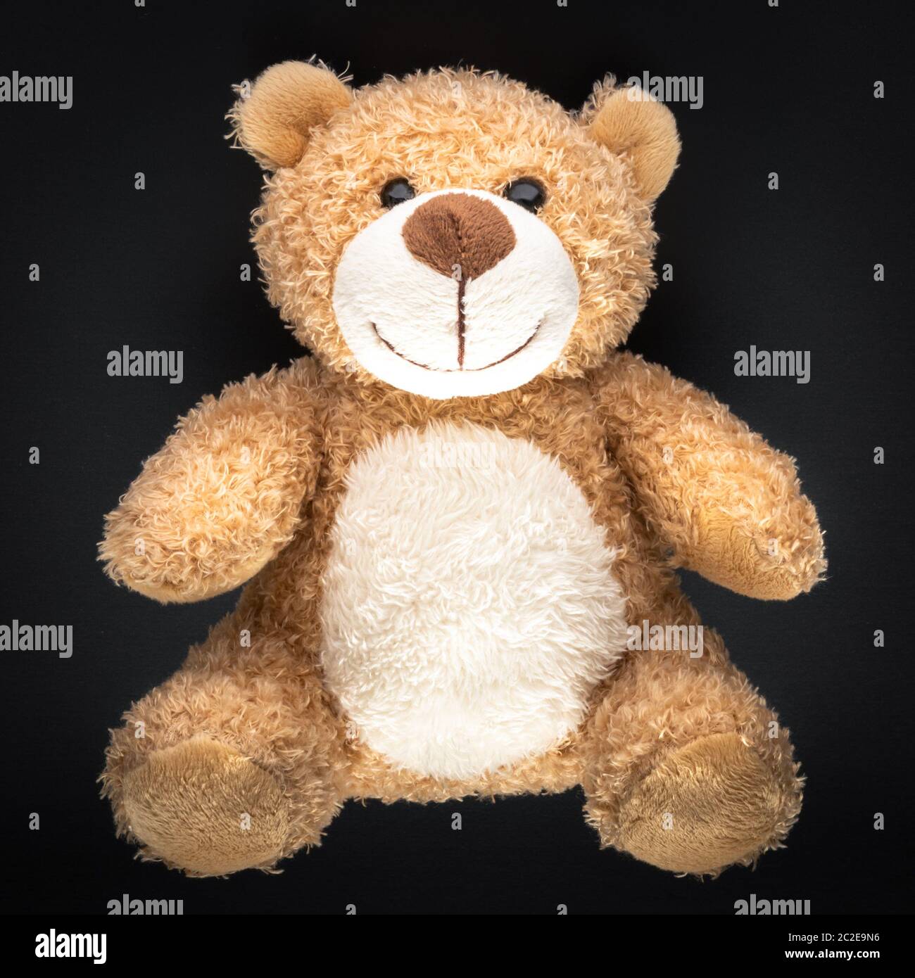 teddy bear isolated on black background Stock Photo