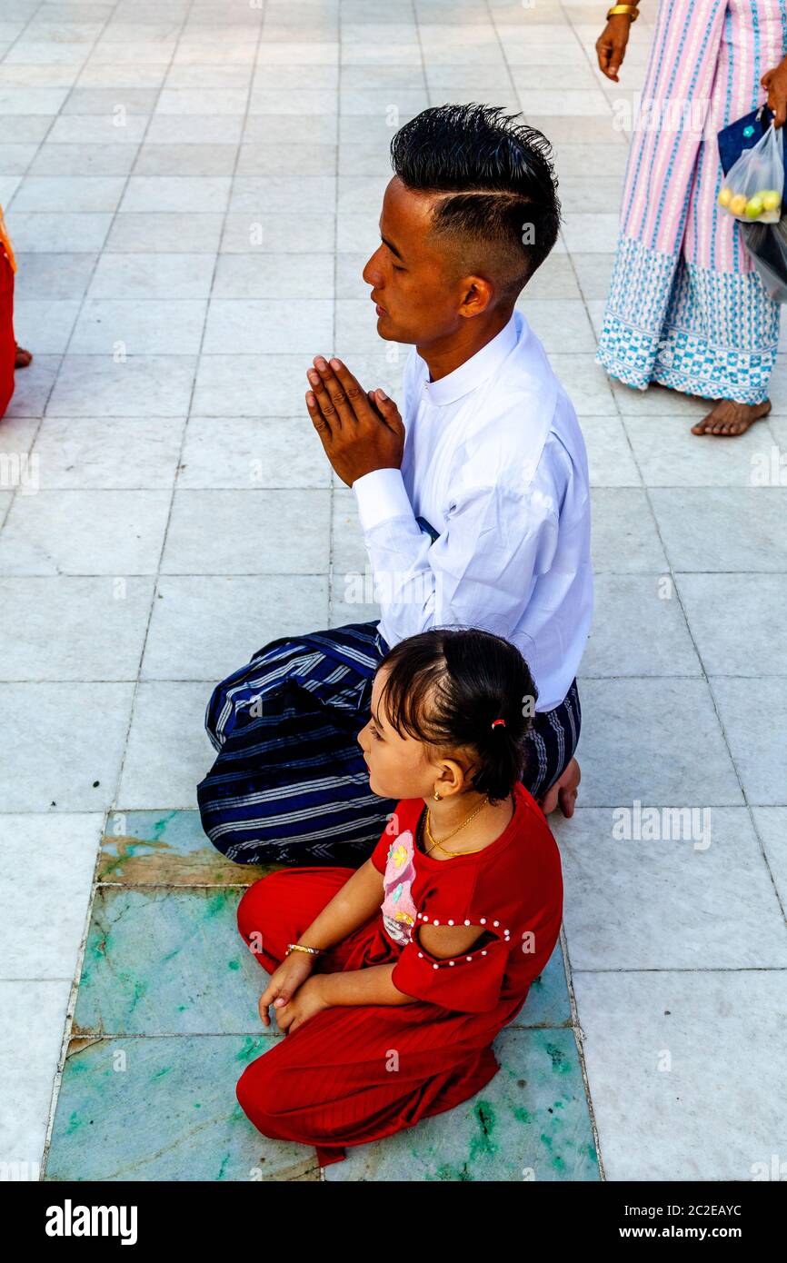 Buddhist People Praying At The Shwedagon Pagoda, Yangon, Myanmar. Stock Photo