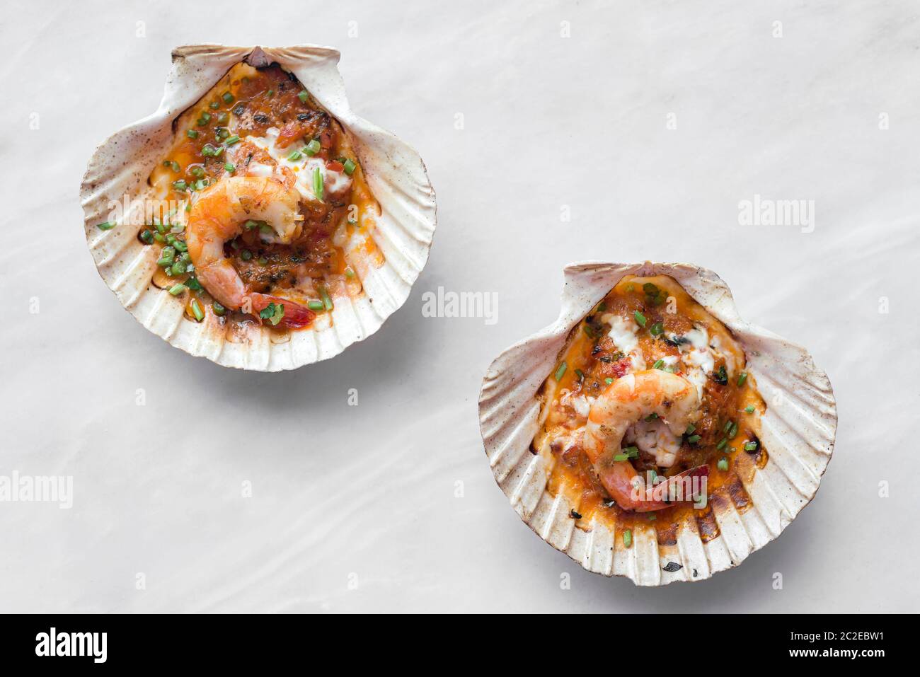 portuguese seafood grilled prawns tapas in spicy tomato piri piri sauce in lisbon restaurant