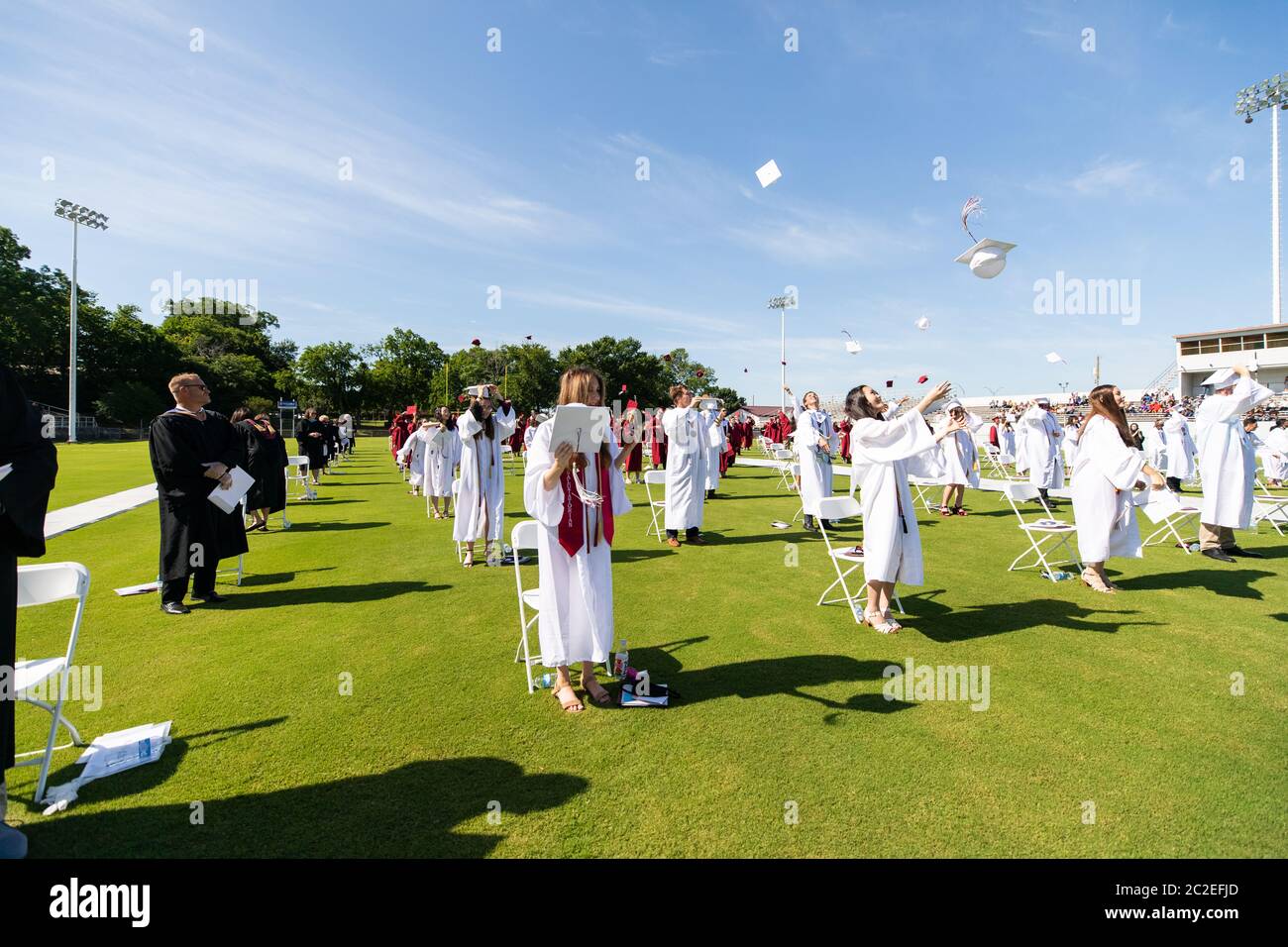 The Sherman High School Class of 2020 commencement ceremony is held on June 13 at Bearcat Stadium in Sherman, TX. Stock Photo