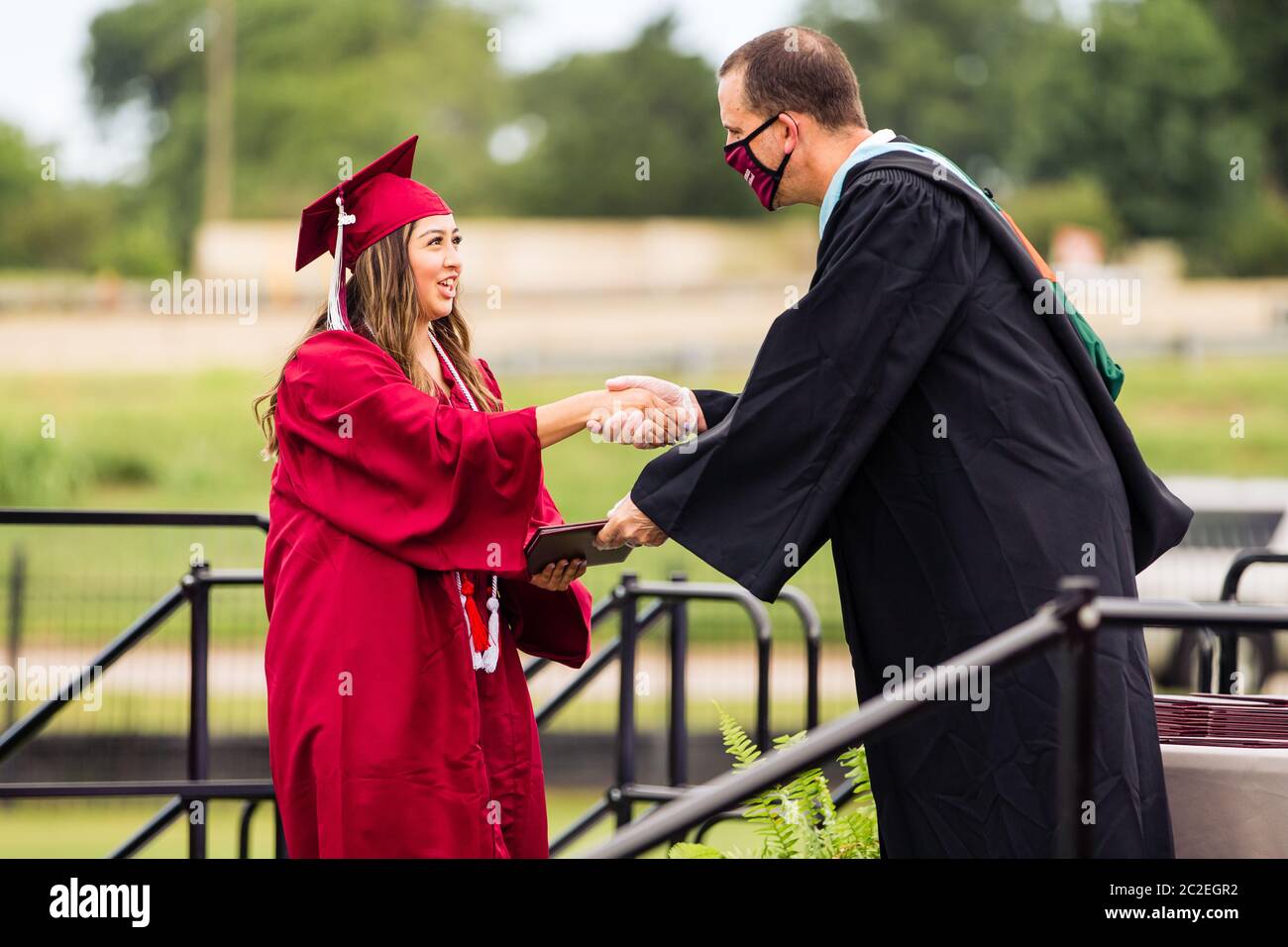 The Sherman High School Class of 2020 commencement ceremony is held on June 13 at Bearcat Stadium in Sherman, TX. Stock Photo