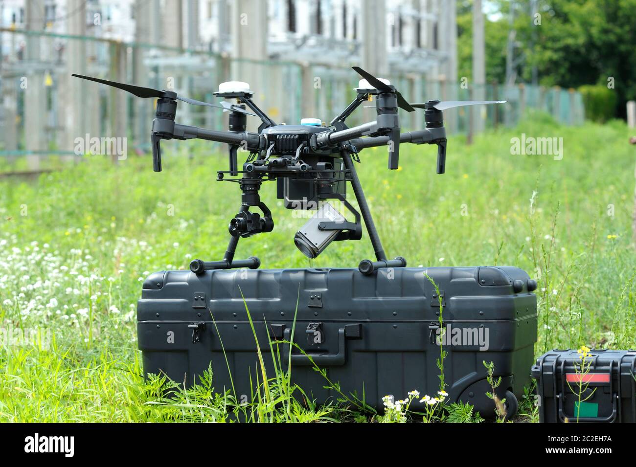 Pro quadcopter with camera and remote control placed on the box before adjusting Stock Photo