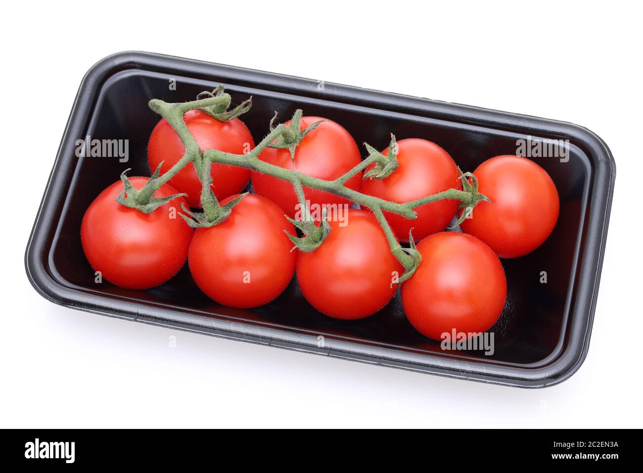 branch of cherry tomatoes in a plastic pack, white background Stock Photo
