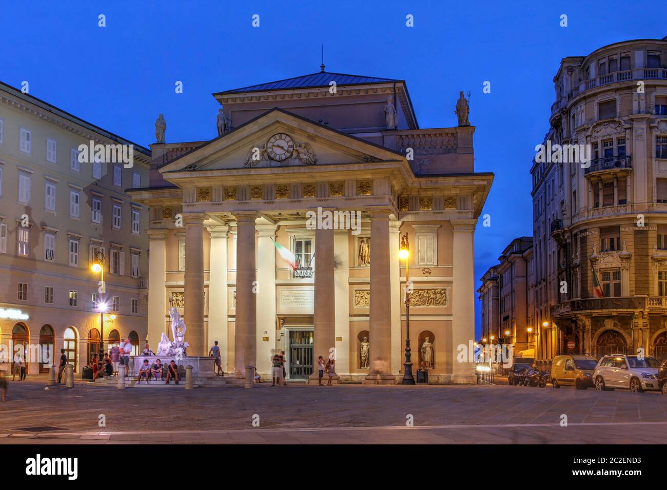 Night scene in the square of the Stock Exchange in downtown Trieste, Italy, with focus on the old neo-classical building of the Stock Exchange. Stock Photo