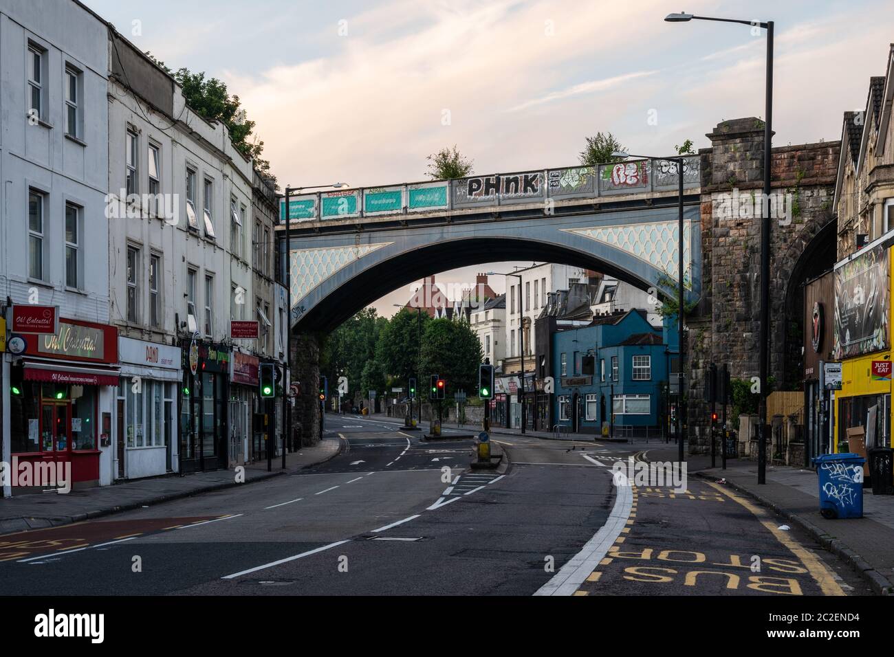 'The Arches', a cast iron Victorian viaduct, carries the Severn Beach Line suburban branch railway across Cheltenham Road, a main shopping street in N Stock Photo