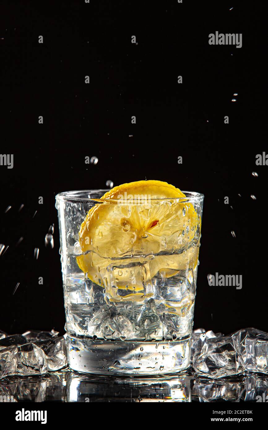 Glass Of Water, Ice And Lemon Stock Photo