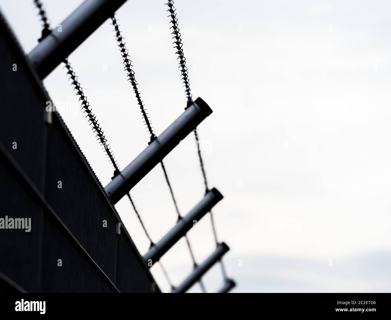 barbed wire fence. symbol of deportation and custody Stock Photo