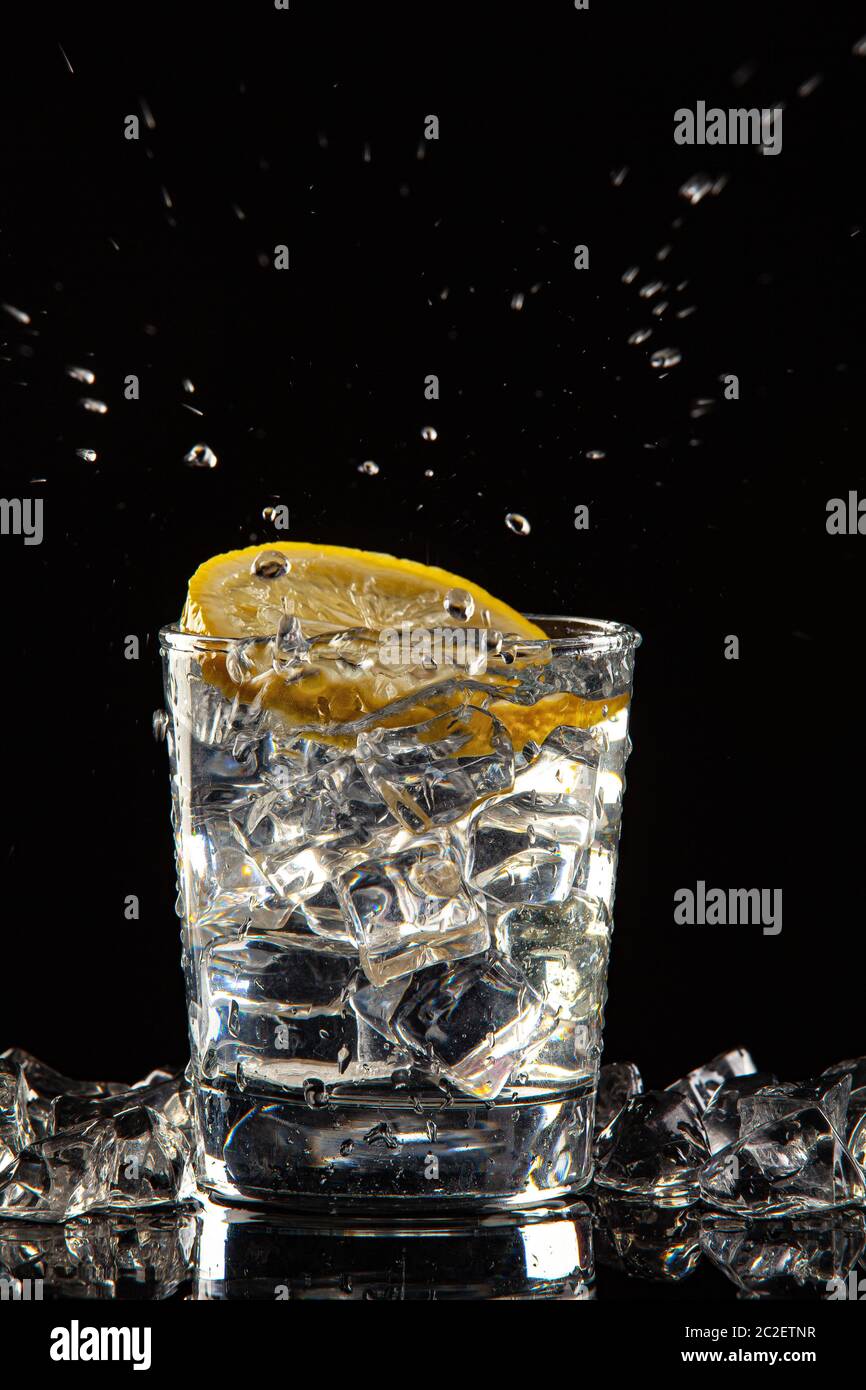 Glass Of Water, Ice And Lemon Stock Photo