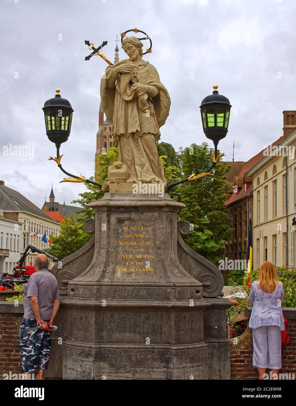 large statue; religious; St. John; Nepomucene; John of Nepomuk; holding crucifix; crown with stars; two lights, saint of Bohemia; patron of calamities Stock Photo