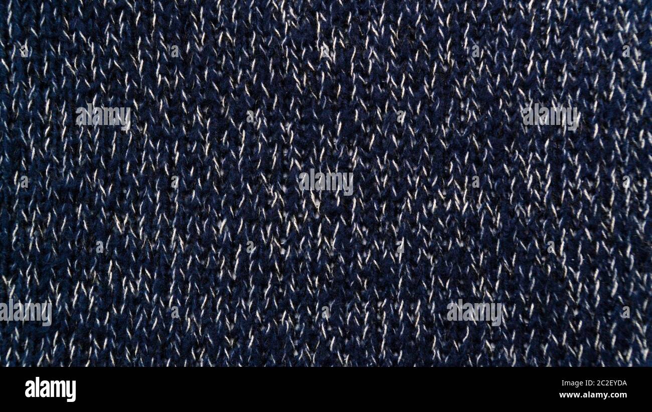 knitted material background dark blue knitting needles Stock Photo