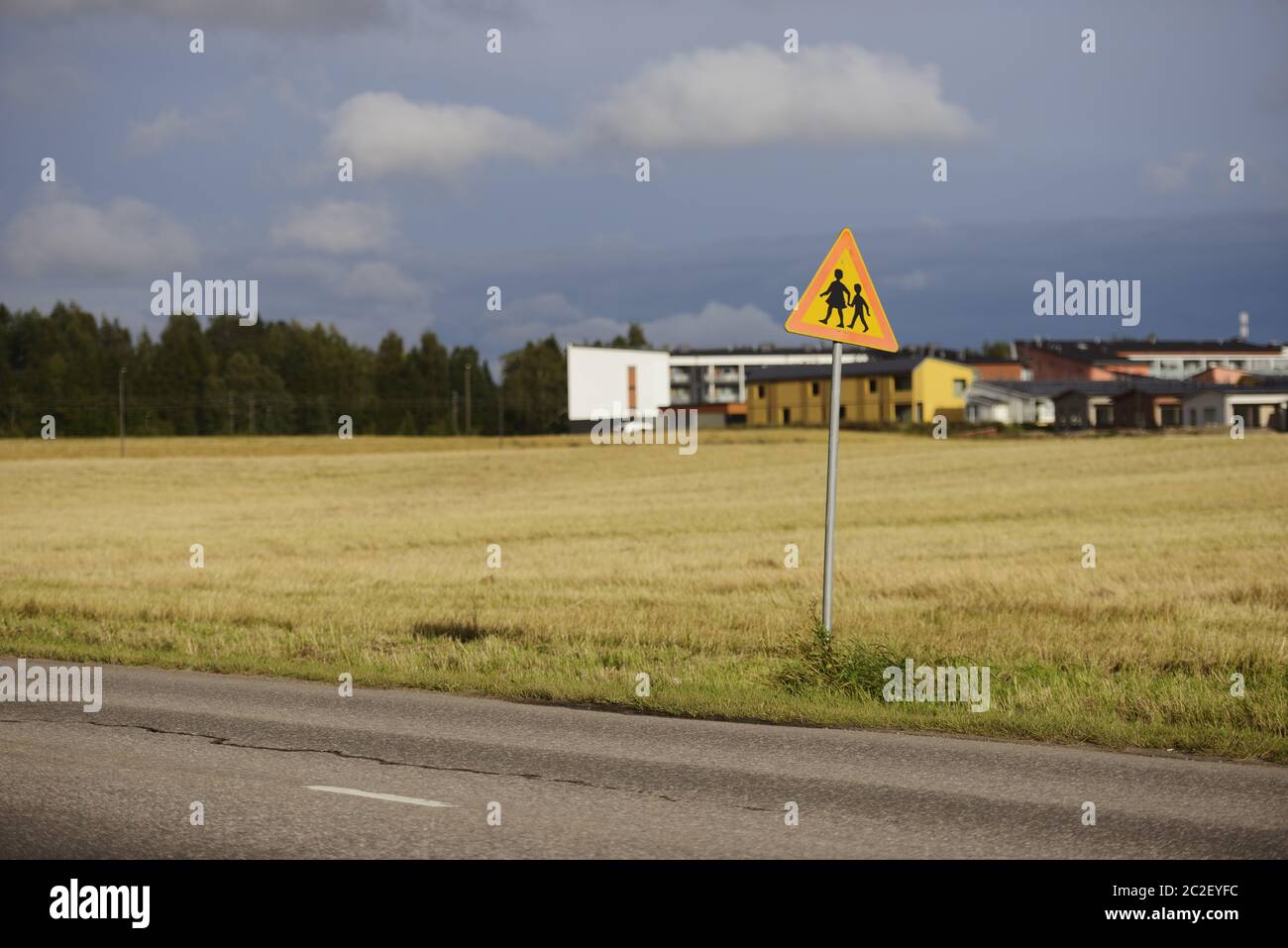 road sign caution children against the town Stock Photo