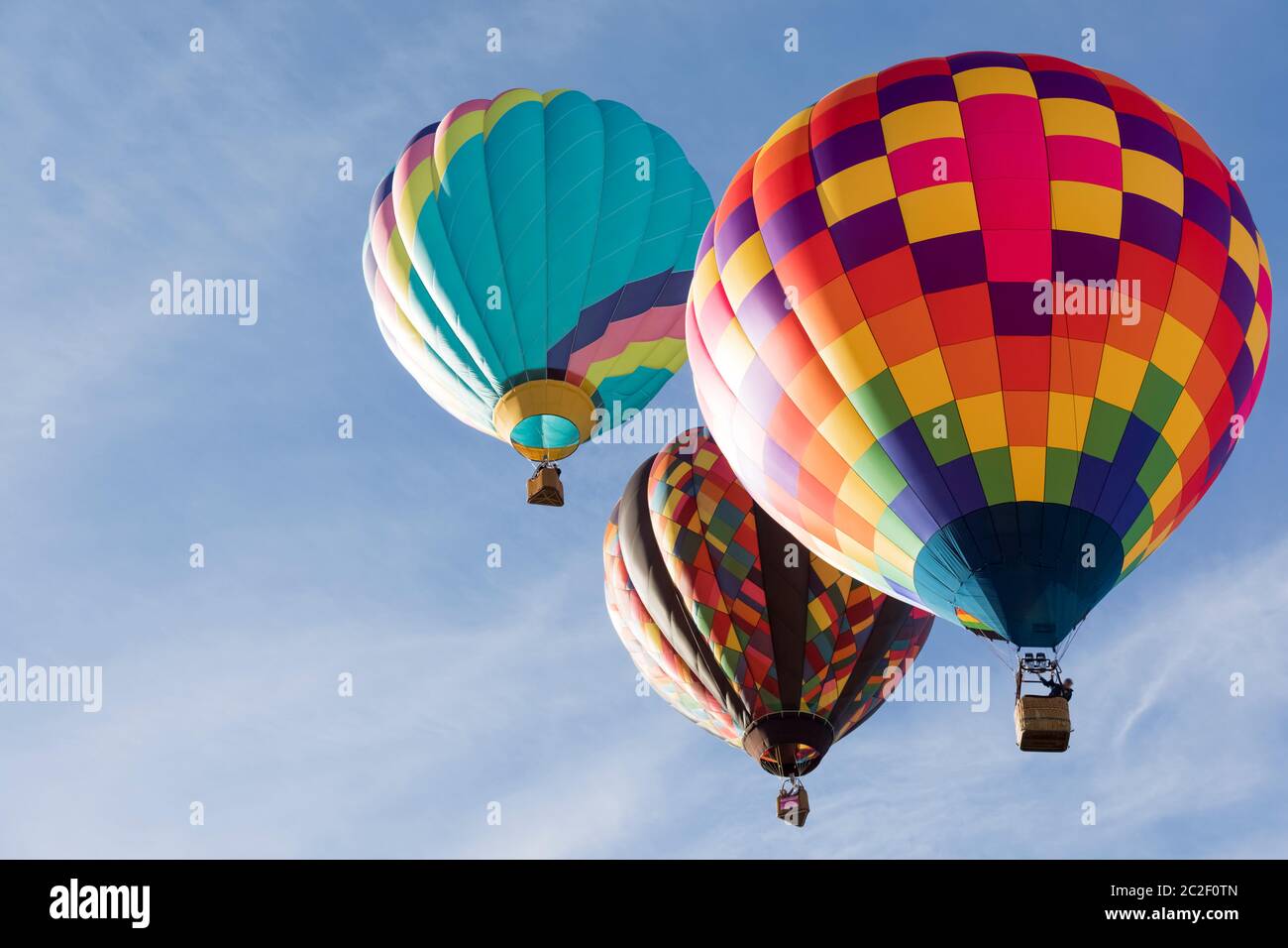 Multi colored hot air balloons on blue sky Stock Photo