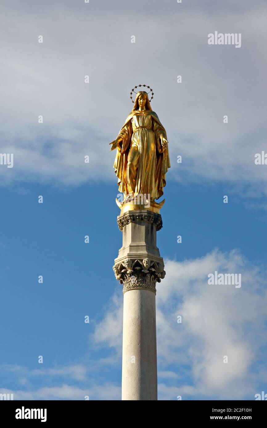 Statue of the Blessed Virgin Mary in front of the sky Stock Photo Alamy