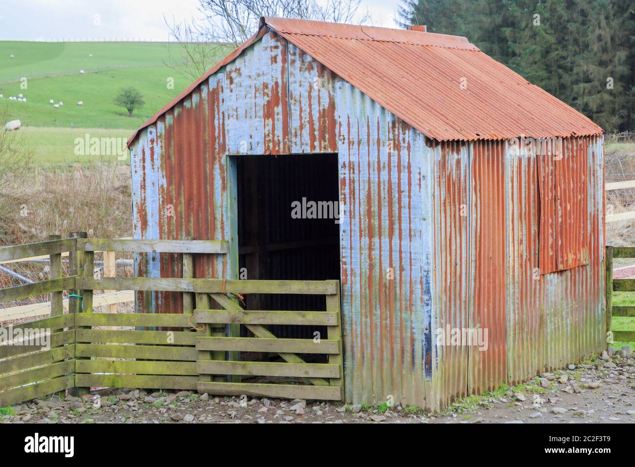 Old rusty corrugated steel shed Stock Photo