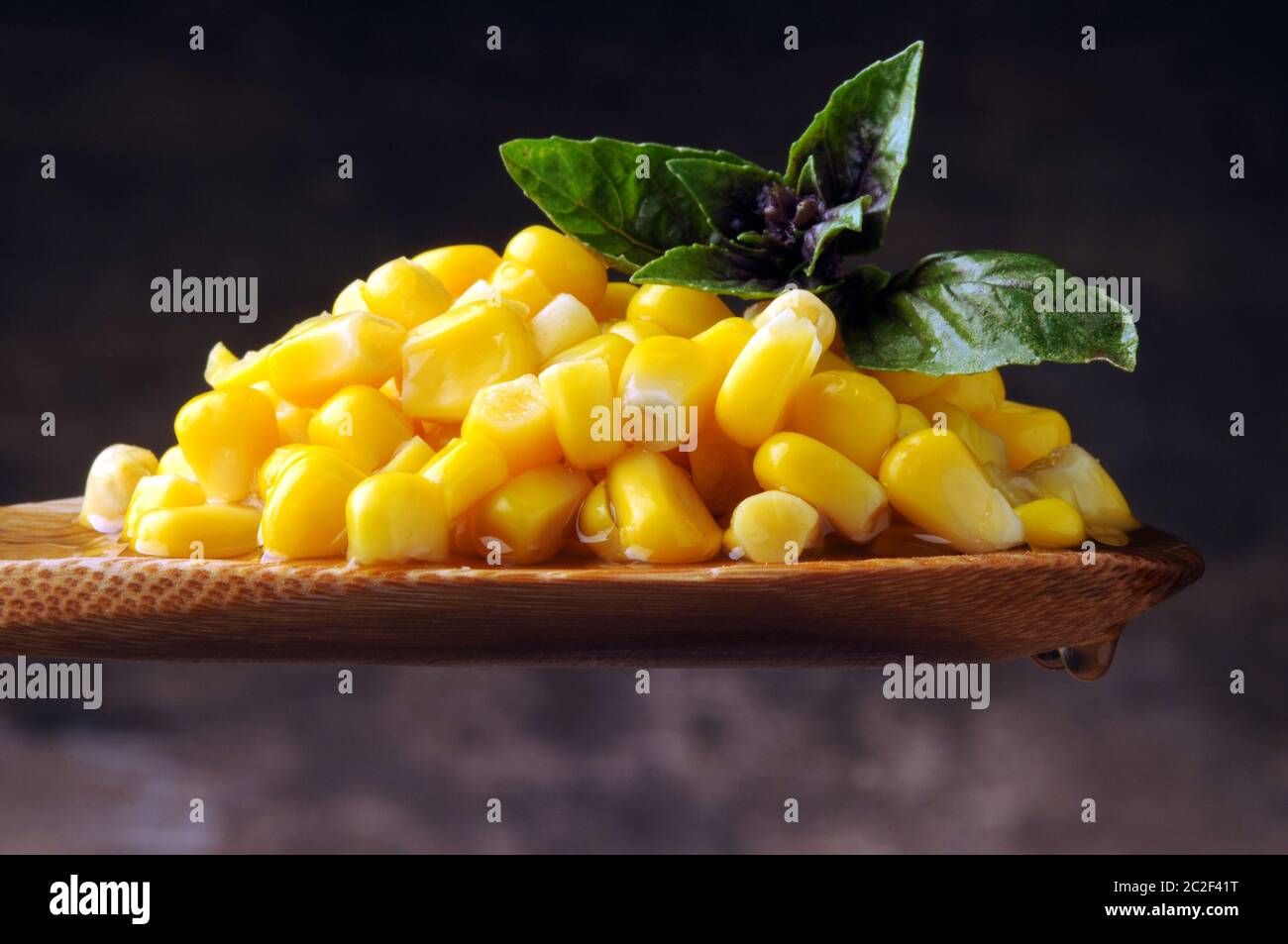 Corn kernels on spoon Stock Photo