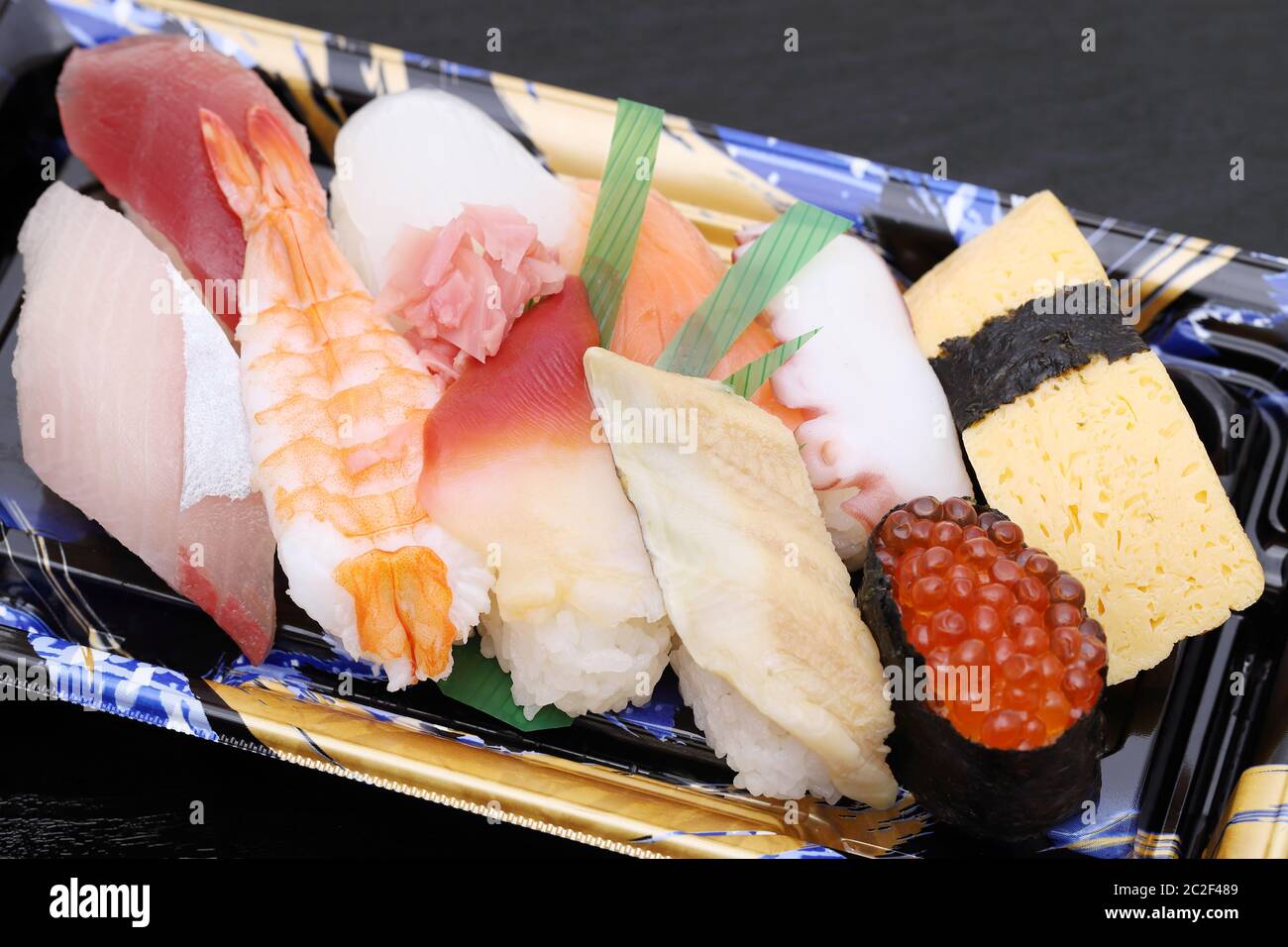 Japanese sushi bento, lunch pack on black background Stock Photo