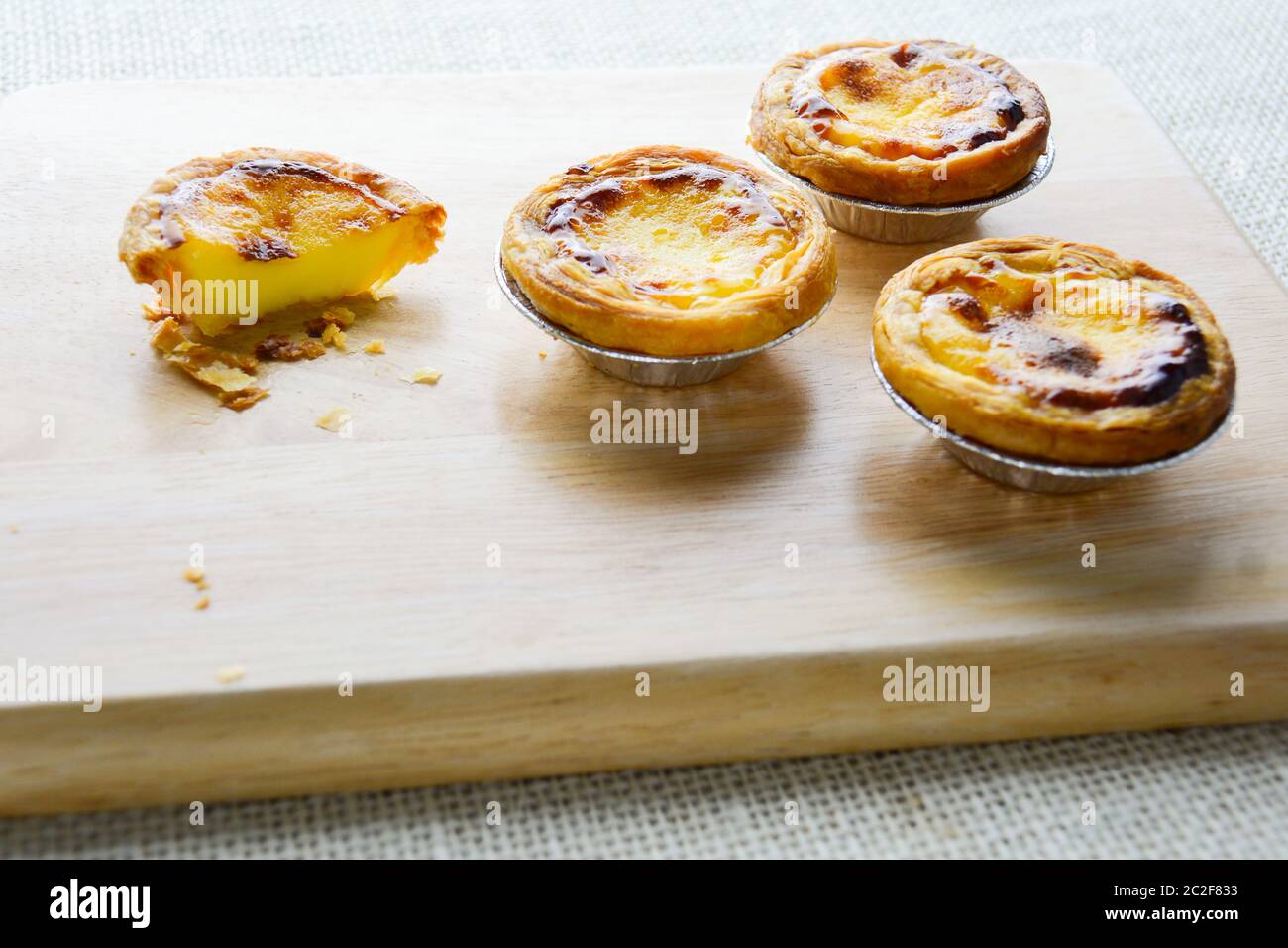 Portuguese Egg Tarts, is a kind of custard tart found in various Asian countries. The dish consists Stock Photo