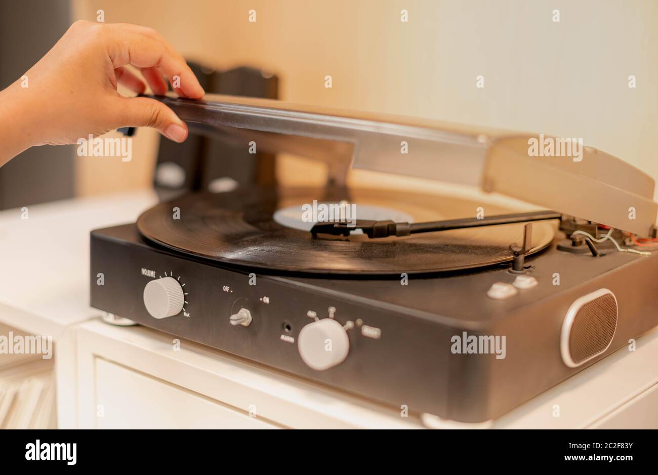 Female Hand Opening The CD Player Machine s Knob And Put On The CD Disc female-hand-opening-the-cd-player-machine-s-knob-and-put-on-the-cd-disc