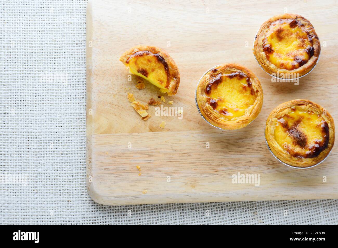 Portuguese Egg Tarts, is a kind of custard tart found in various Asian countries. The dish consists Stock Photo