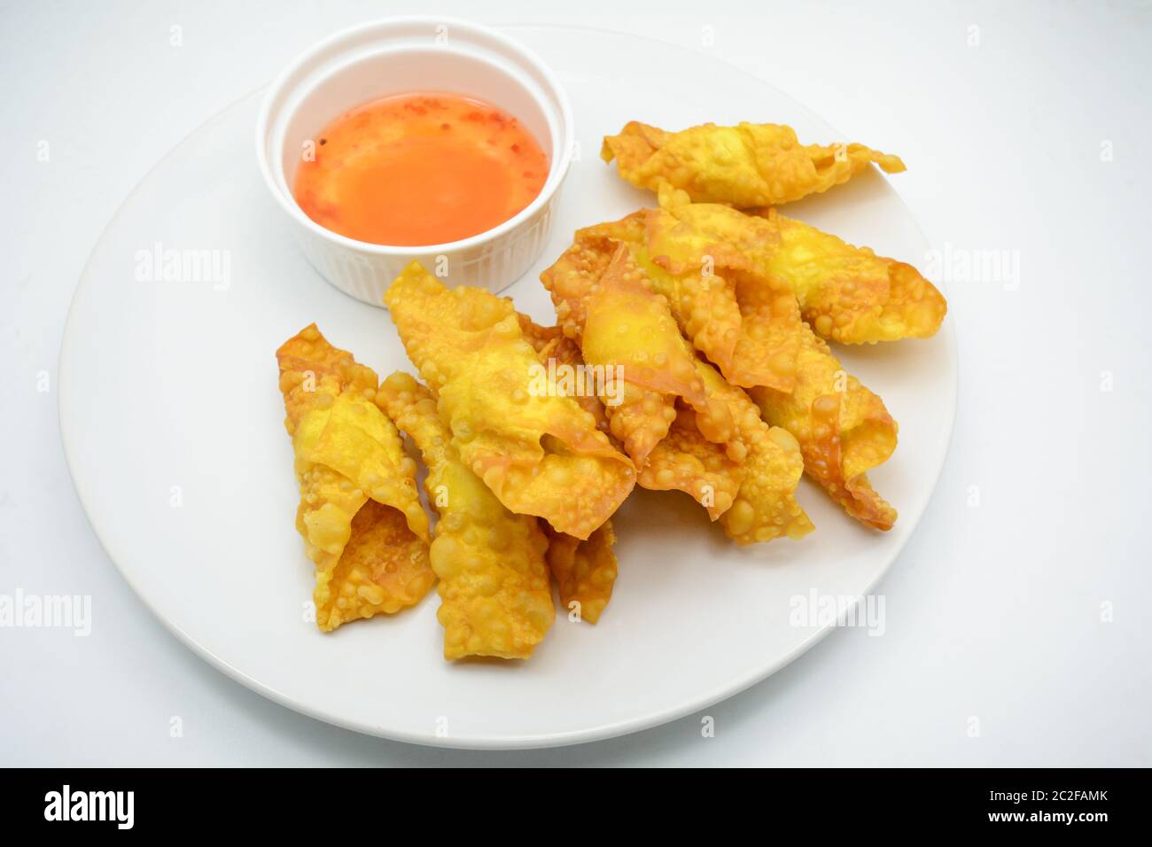 Deep Fried Won ton on white plate with dip source Stock Photo