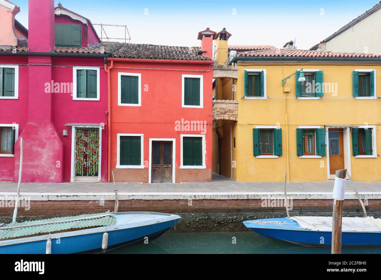 Retro houses with colorful facades on Burano island canal Stock Photo ...