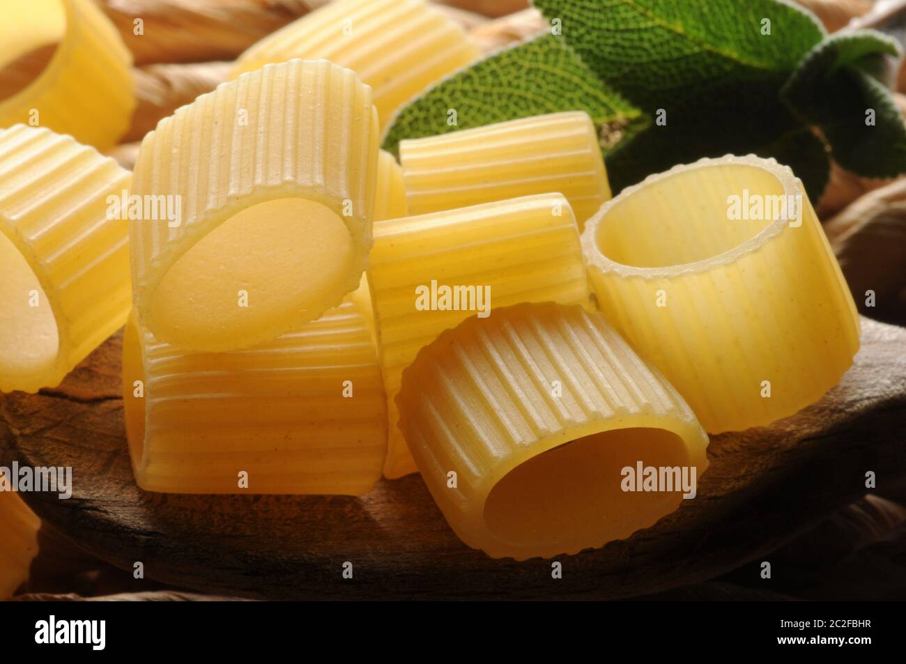 Mezze maniche rigate in the spoon Stock Photo