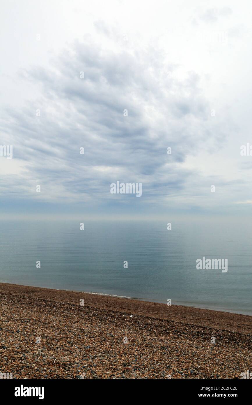 Grey sky over shingle beach, Marine Parade, Folkestone, Kent, England